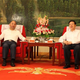 Wang Wenying meeting with Tianjing city’s party secretary in June. (Amer International)